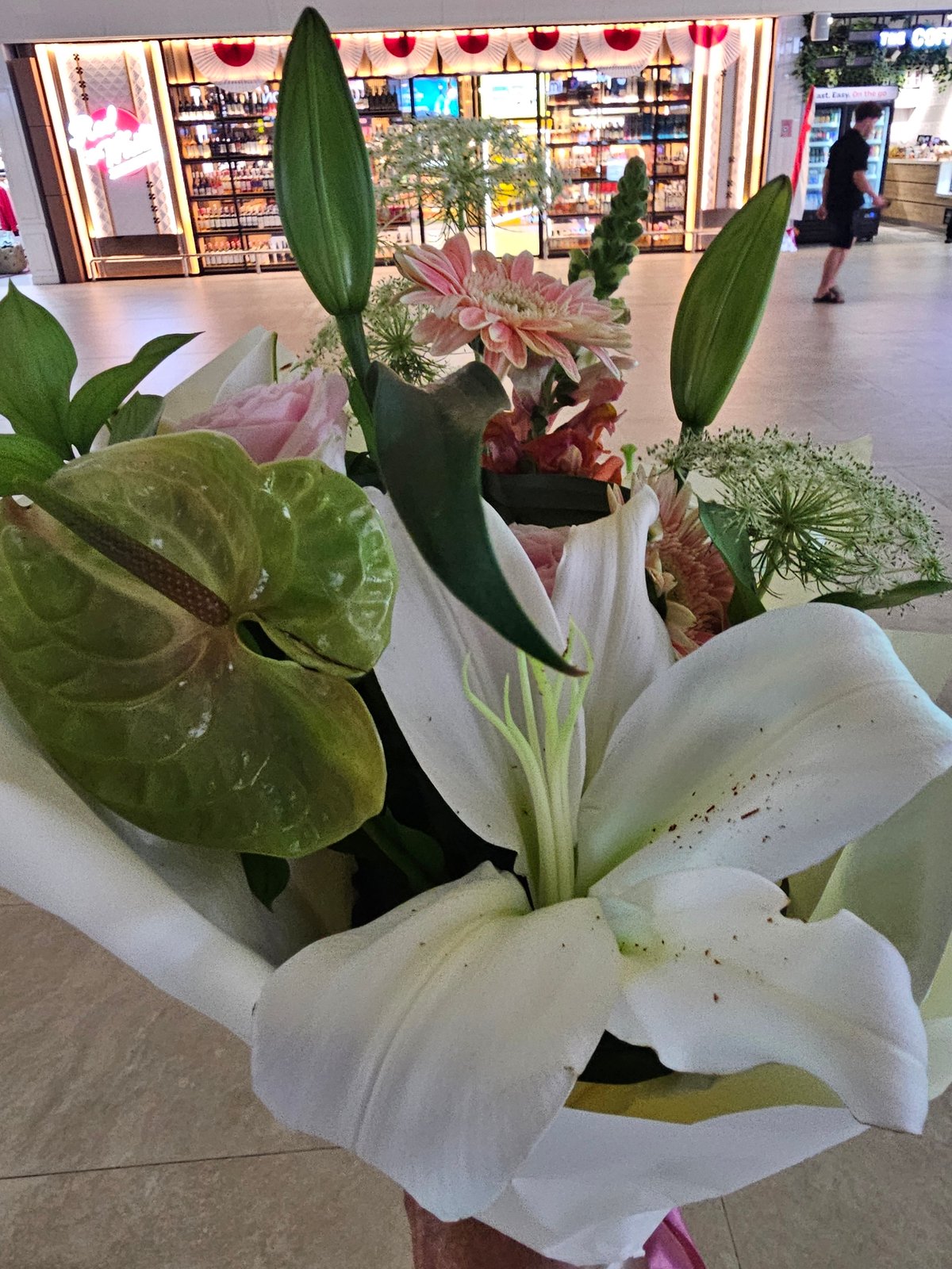 Flowers and familiar faces at Bali's international airport