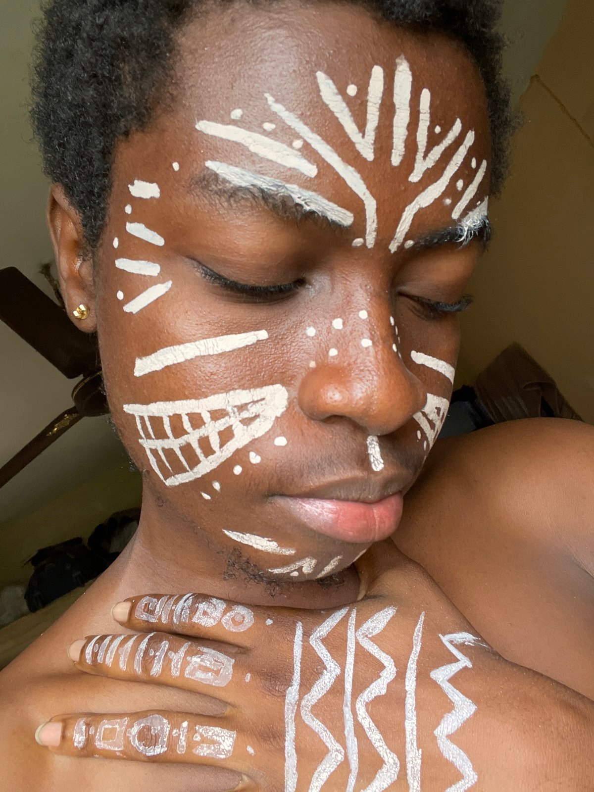 Traditional white body paint portraits documented in Nkpor, Nigeria