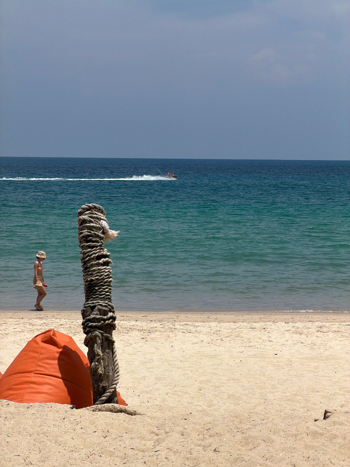 Tourist captures sunny beach moments in Choeng Thale, Thailand