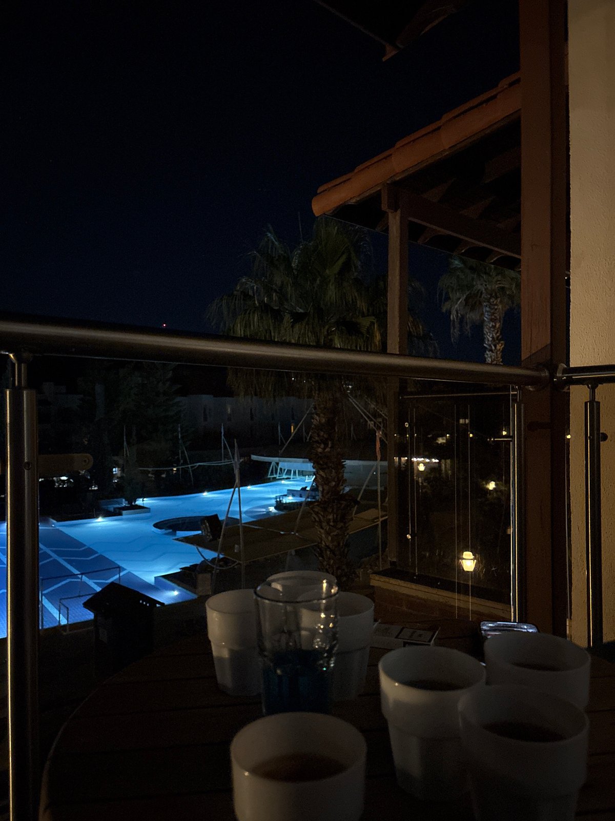 Full moon illuminates resort pool in nighttime Selçuk scene
