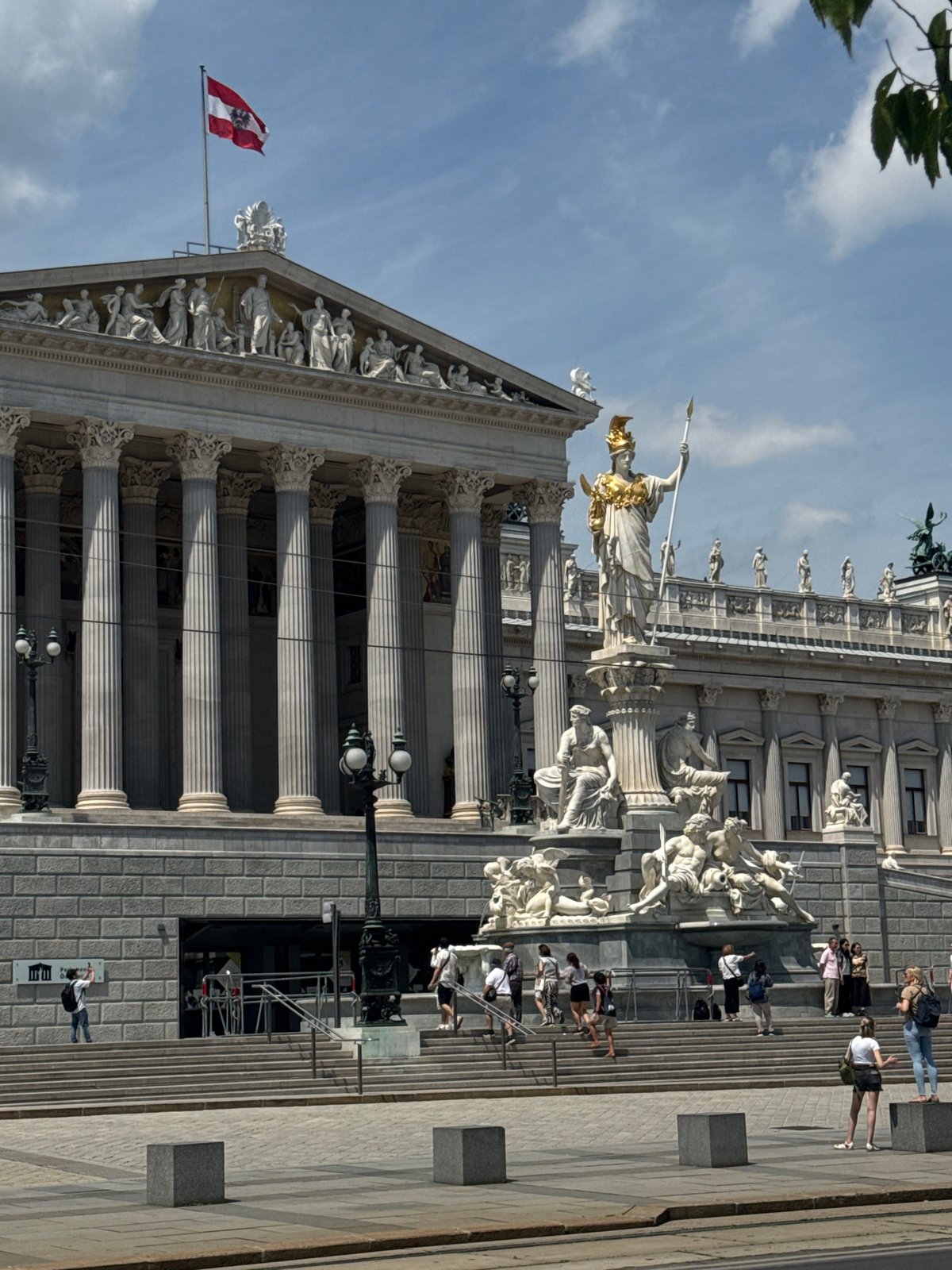 Classical architecture with marble columns documented under clear skies
