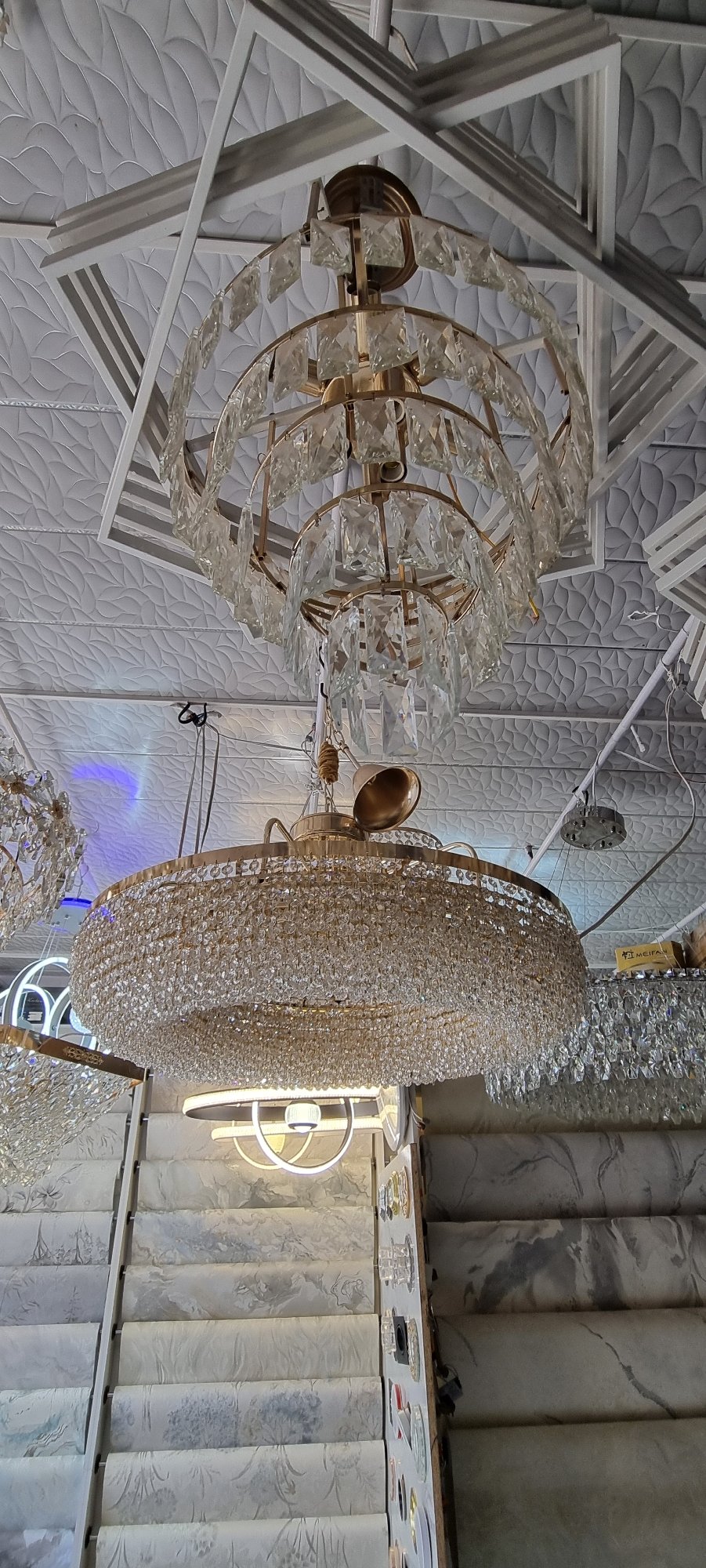 Inside a Bokhtar home decor shop stocked with chandeliers and wallpaper