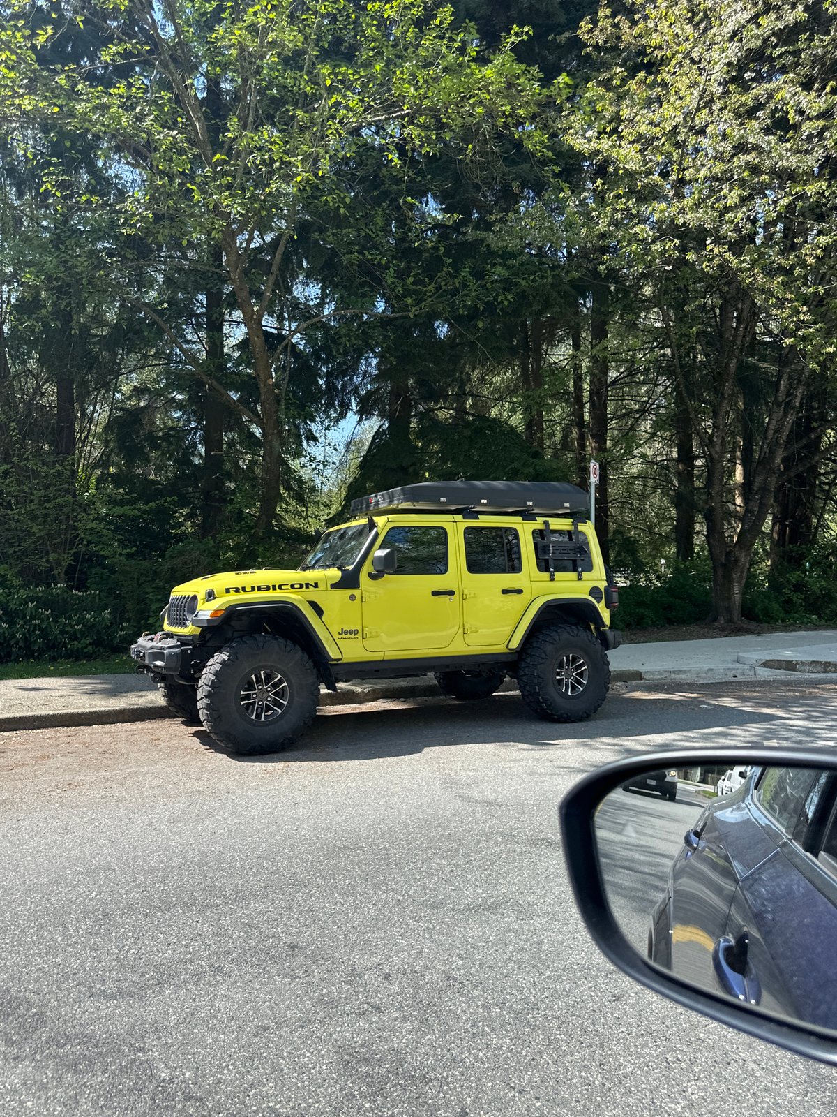 Yellow Jeep Rubicon parked on Coquitlam roadside