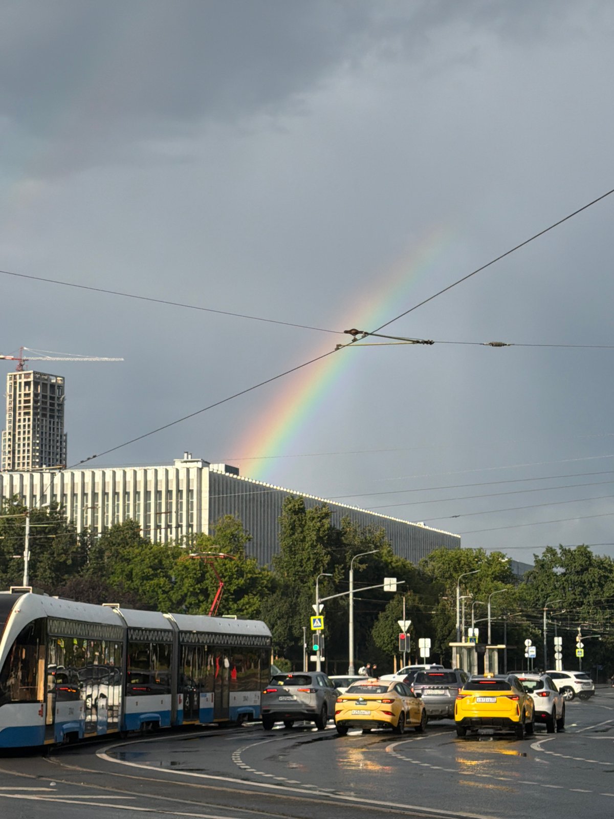 Rainbow over a wet Moscow intersection after summer rain