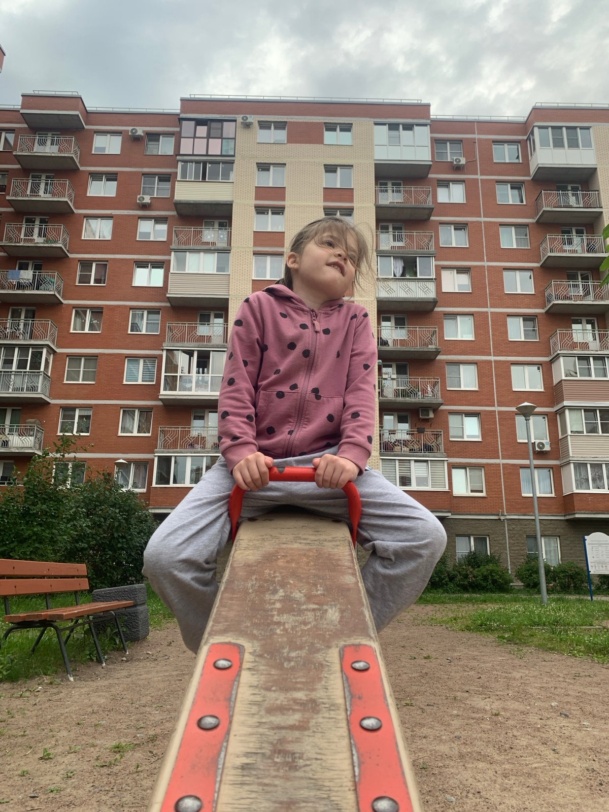 Playground and jasmine blooms in a Kolpino neighborhood