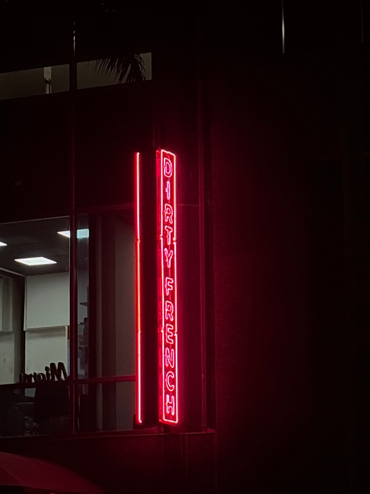 Nighttime Miami scenes show restaurant signage and street traffic