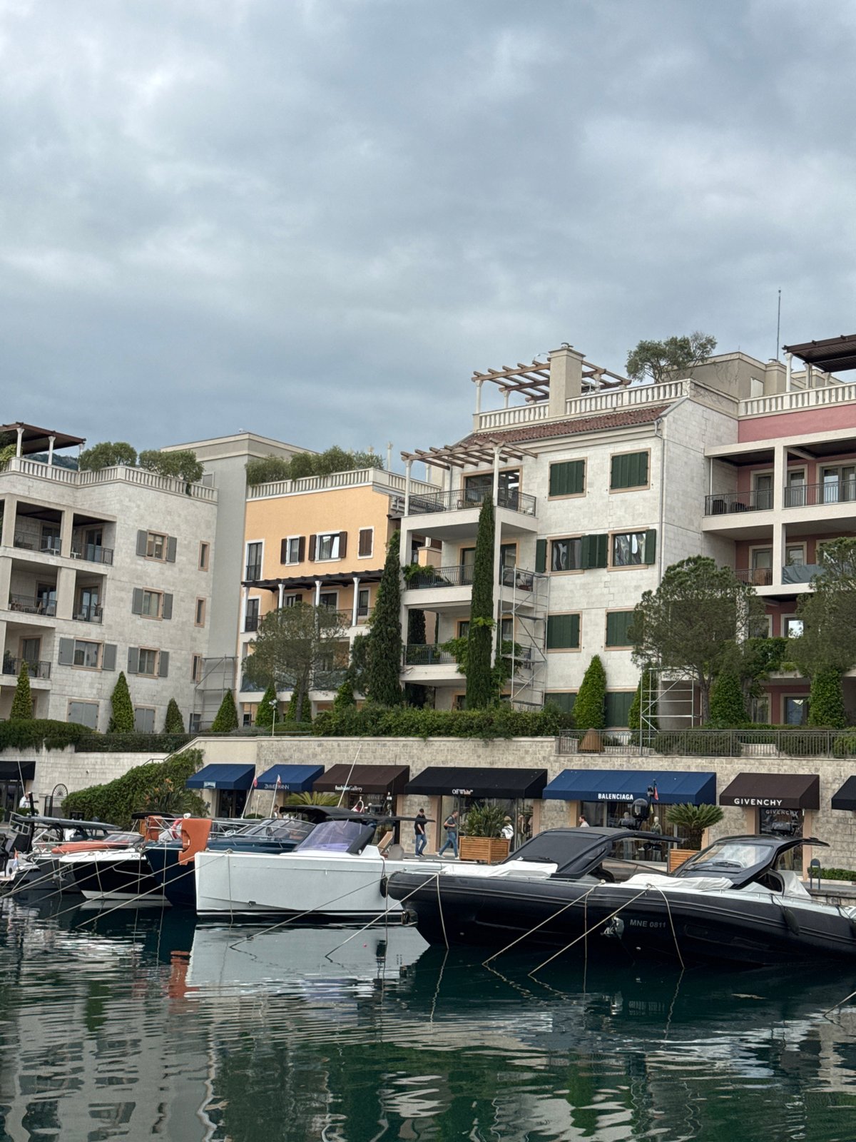 Tivat waterfront luxury shopping and local café documented simultaneously