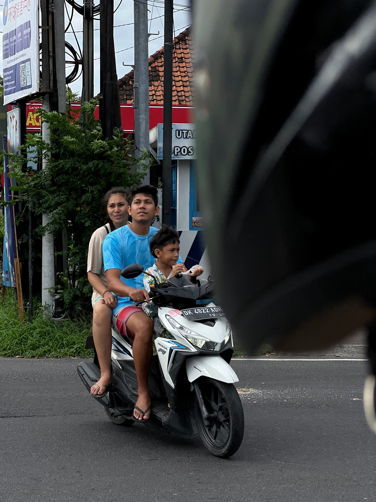 Three riders spotted on white Honda motorcycle in Denpasar