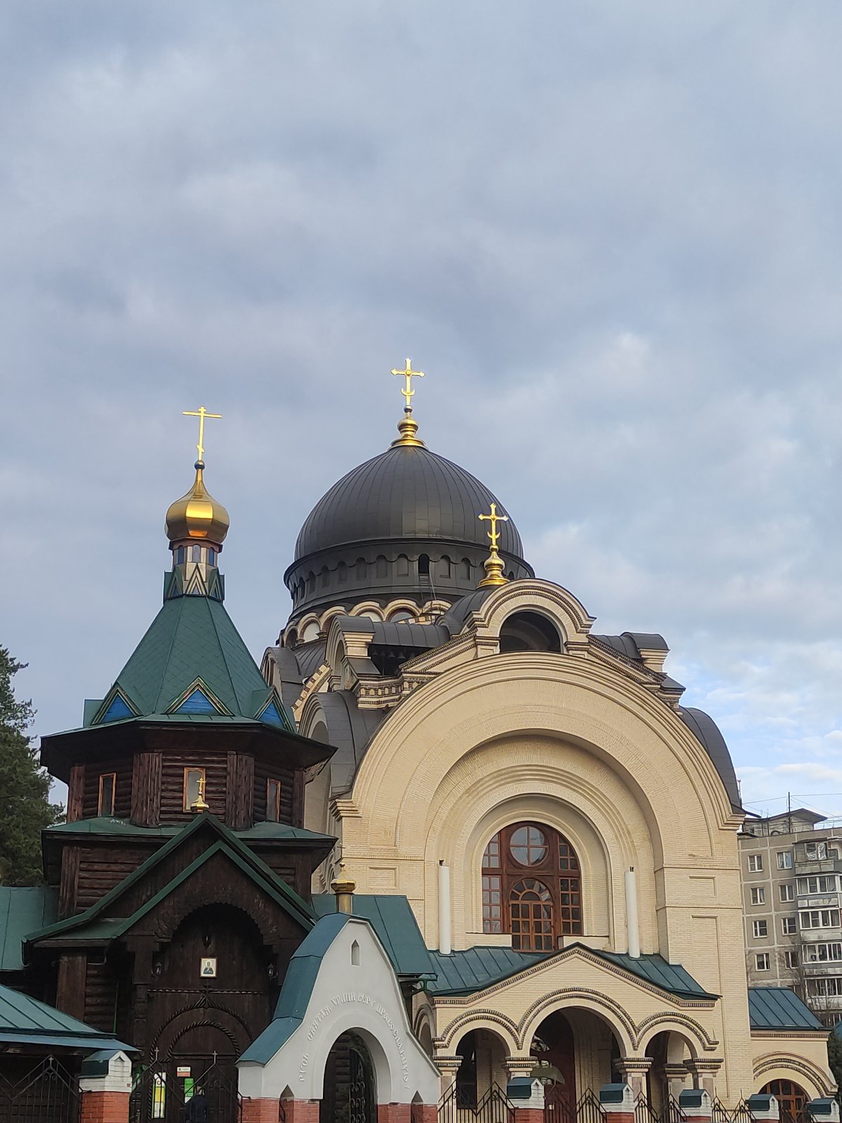 Urban church complex with distinctive domes observed April 17
