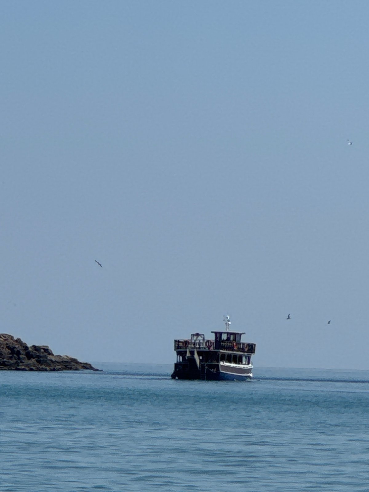 Ferry, paddleboards, and calm Black Sea waters at Sozopol