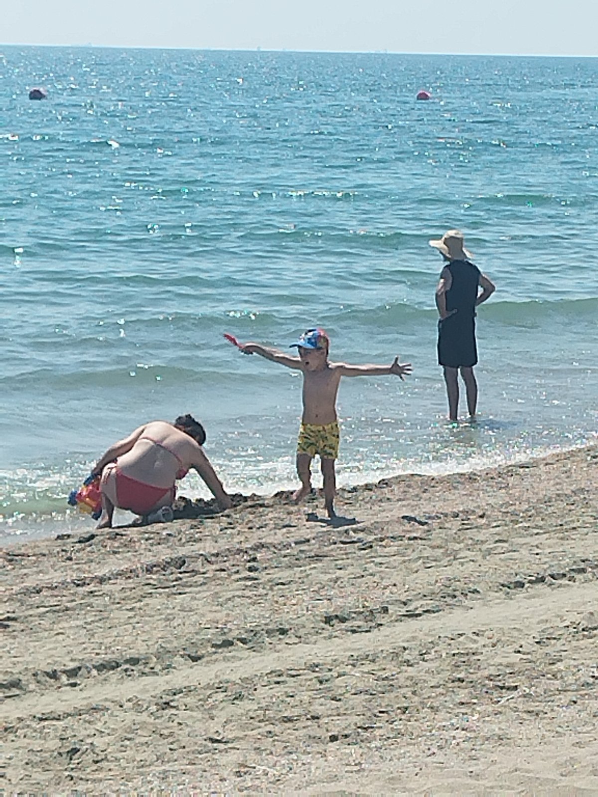 Crowded summer beach day on Romania's Black Sea coast