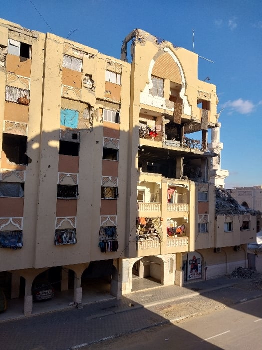 Witness documents damaged buildings, settlements in Khan Yunis