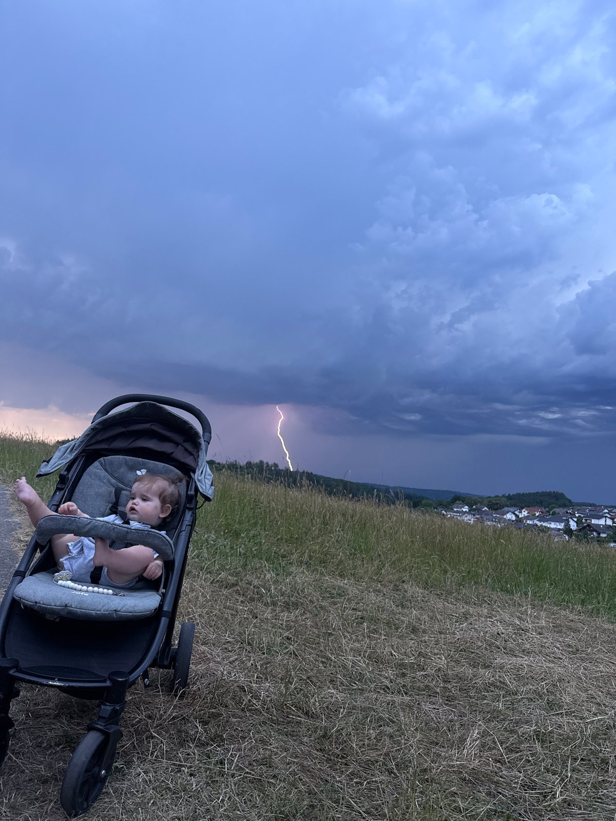 Storm rolls into Oberquembach during an evening walk on the hills