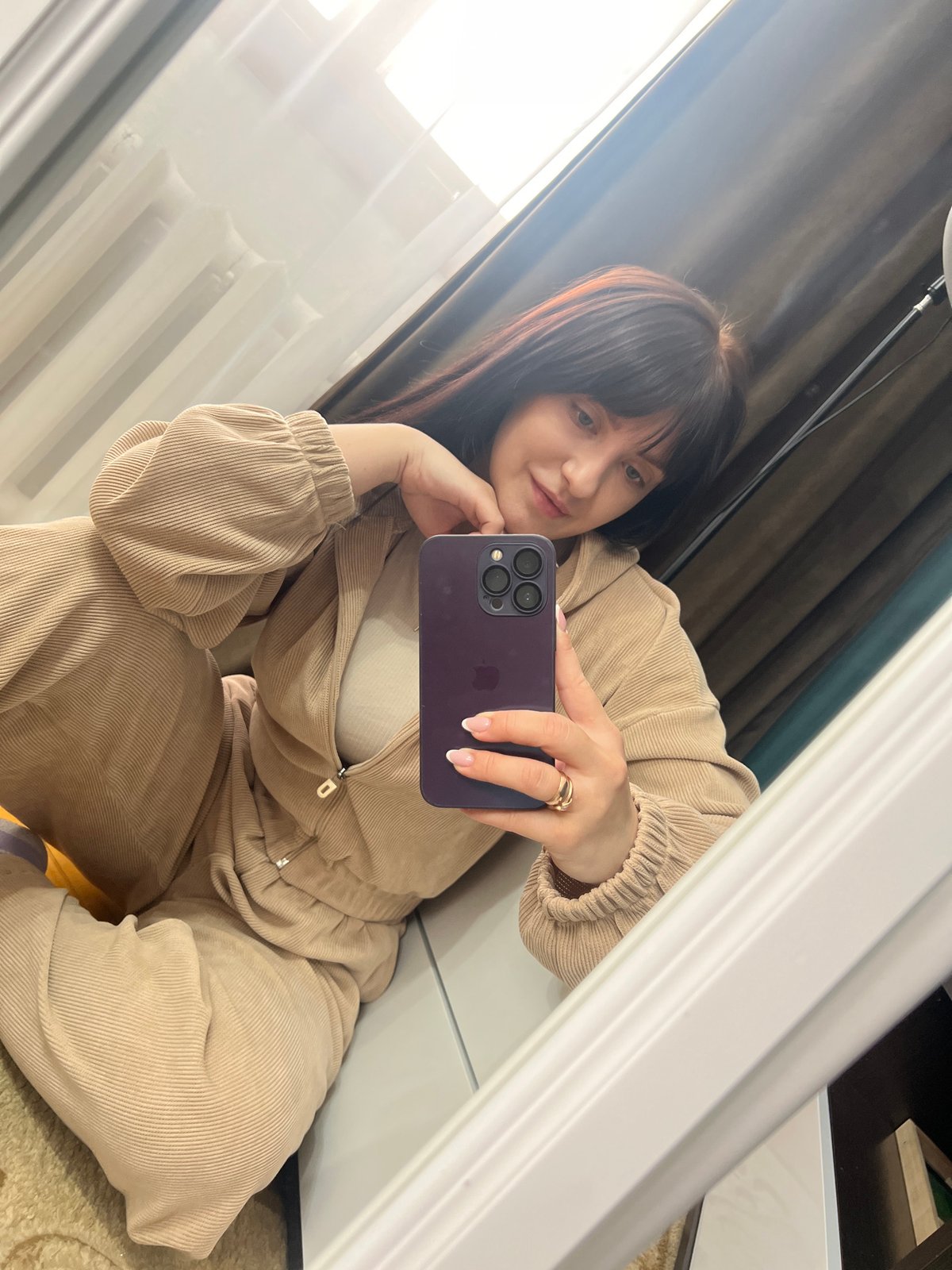 Woman takes morning selfies in Russian apartment building