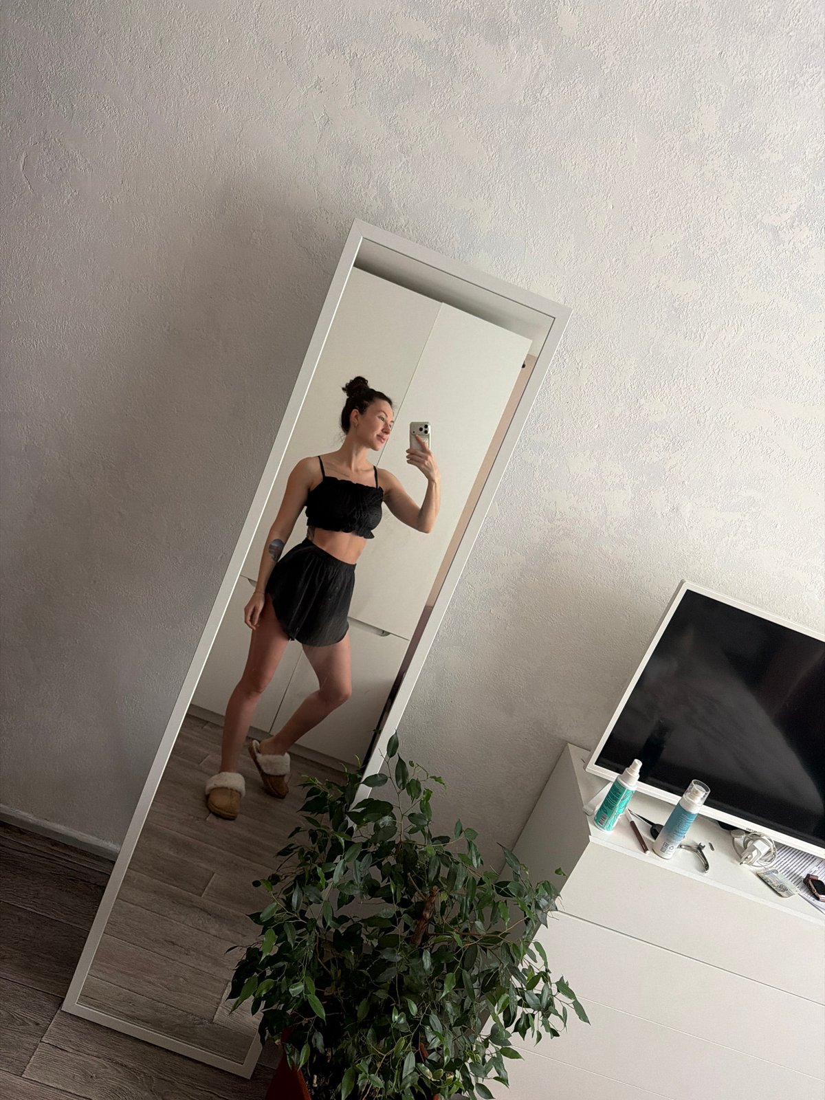Woman takes morning mirror selfies in Perm, Russia
