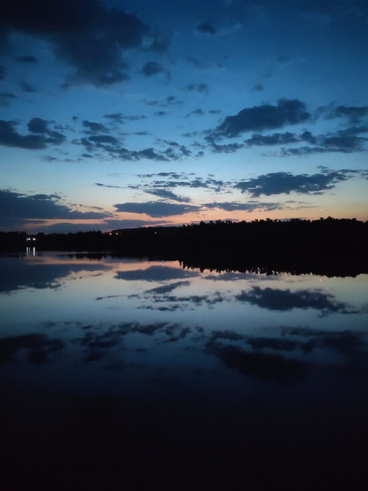 Twilight waterfront scenes documented in Ermolino, Russia