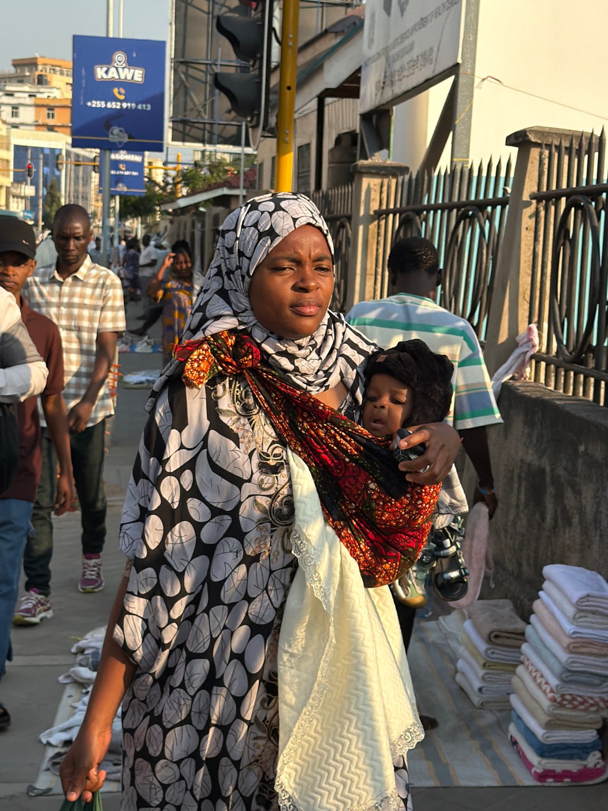 Midday street traffic flows through urban Dar es Salaam