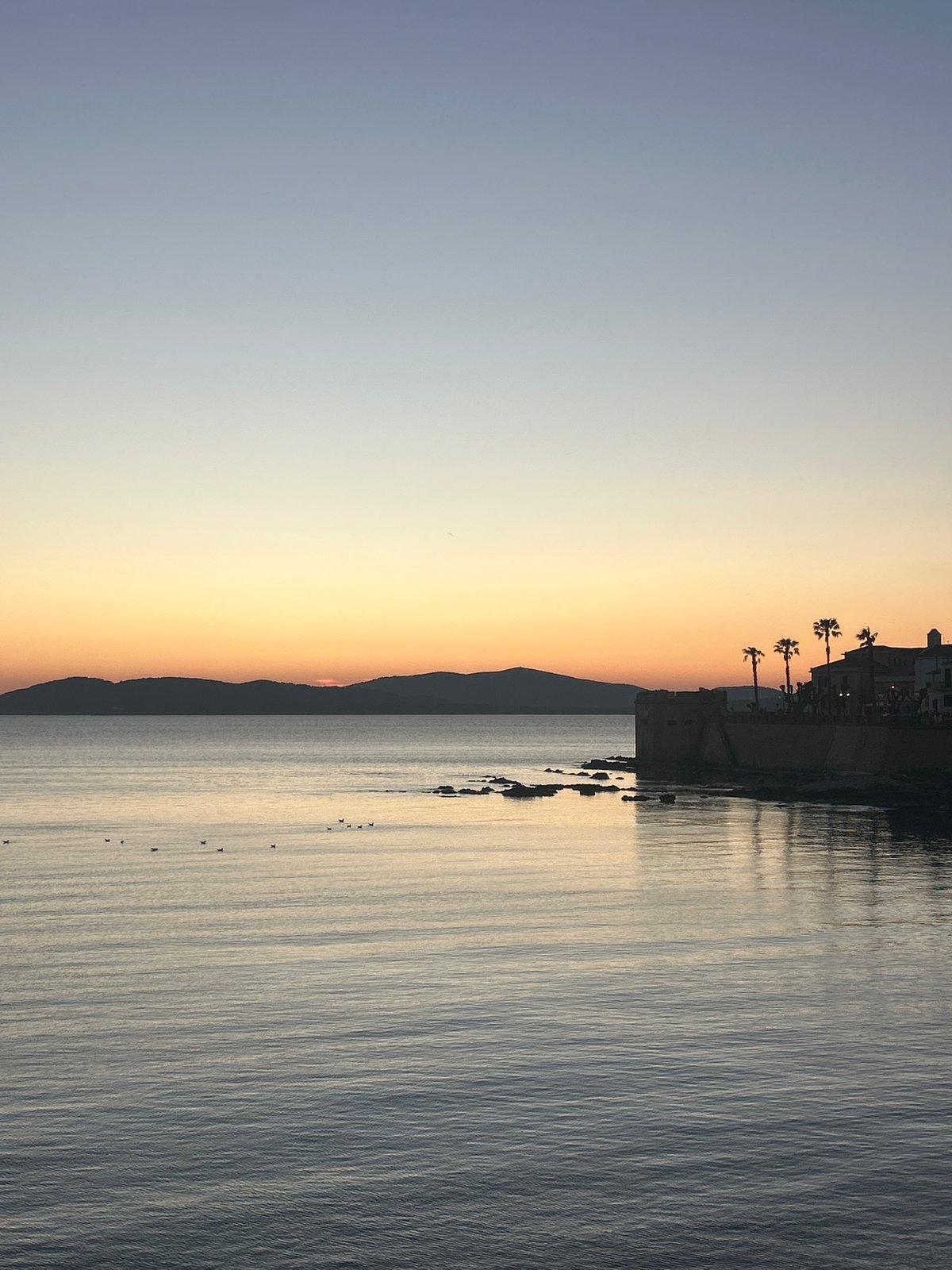 Evening scenes captured in coastal Alghero, Italy