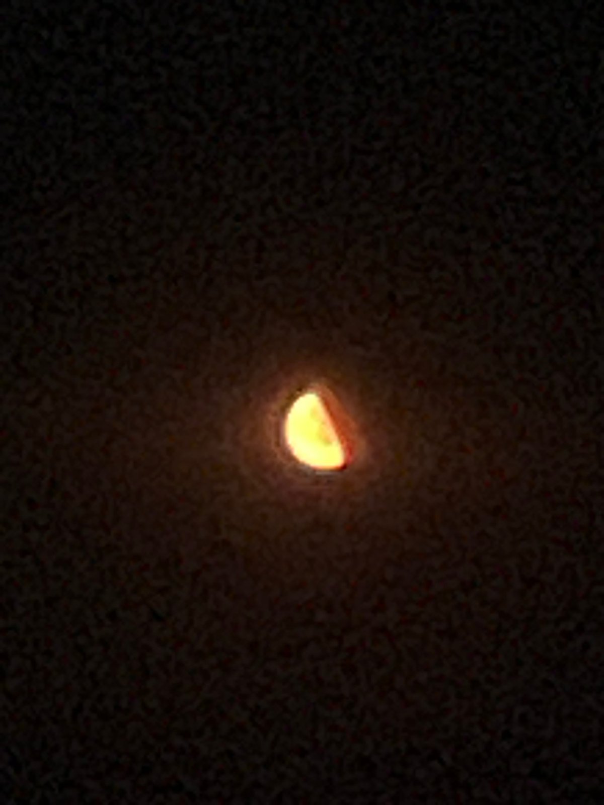 Orange moon rising over Obzor on a summer night