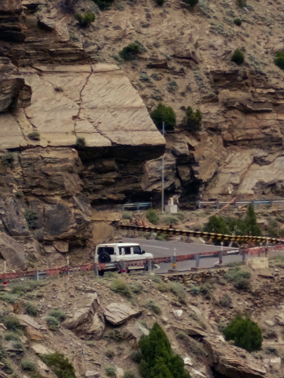 Mountain road journey through Stingri's dramatic river gorge
