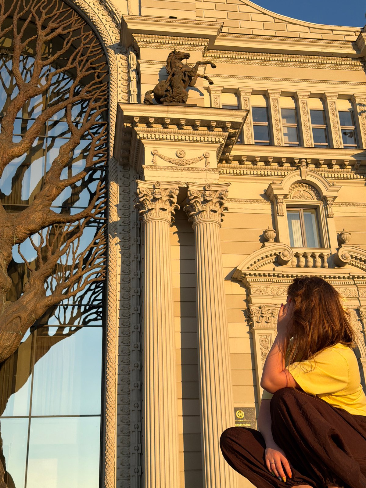 Tourists photograph Kazan landmarks during golden hour visit