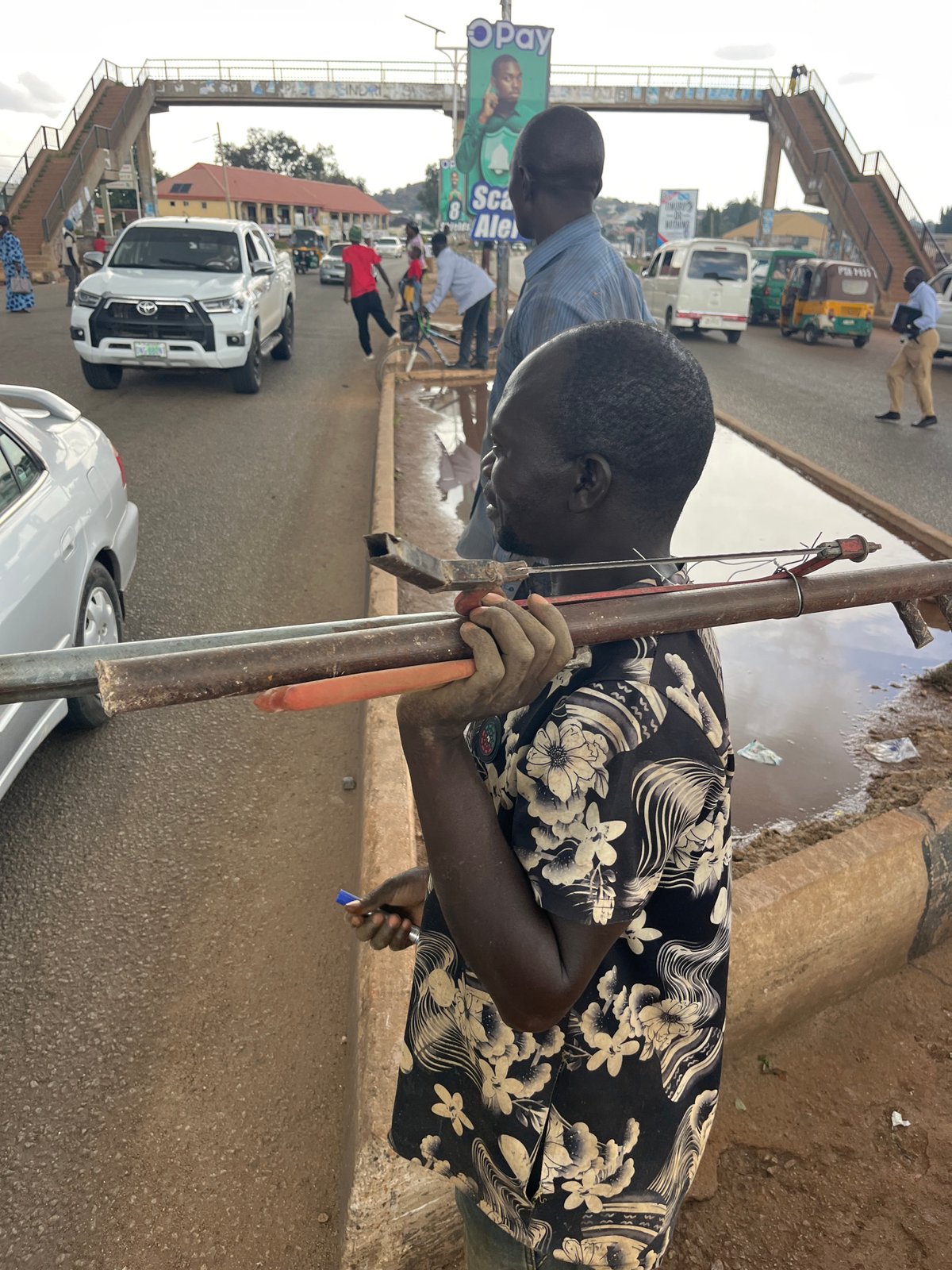 Busy street scenes at an African urban market or transit hub
