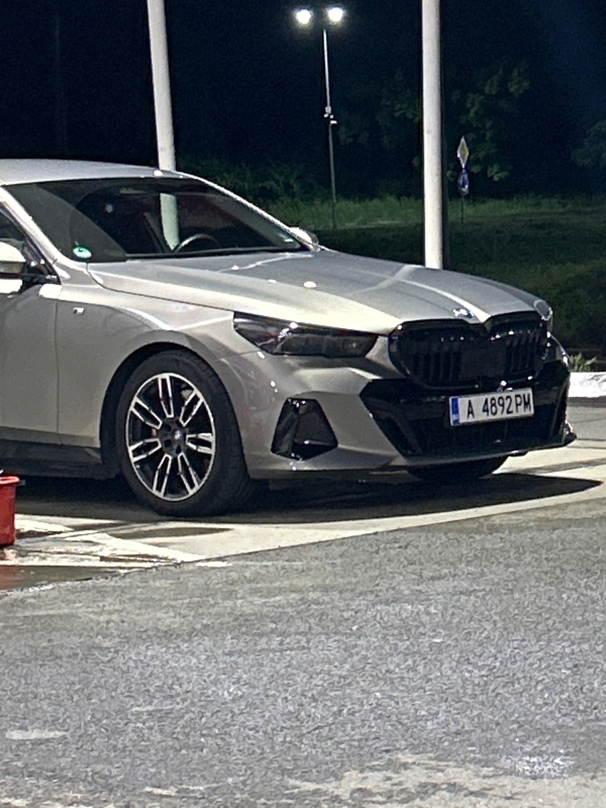 Silver BMW parked on Burgas street during nighttime