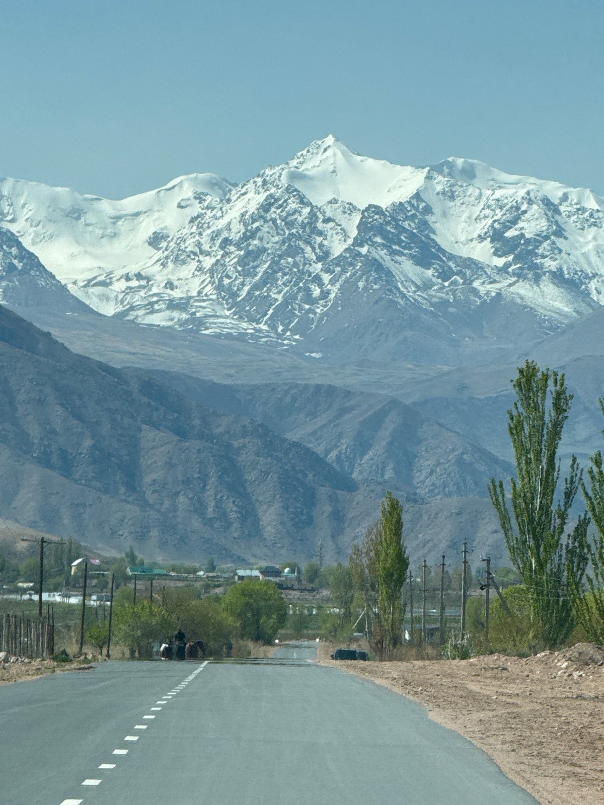 Snow-capped mountains observed near Tong, Kyrgyzstan at dawn