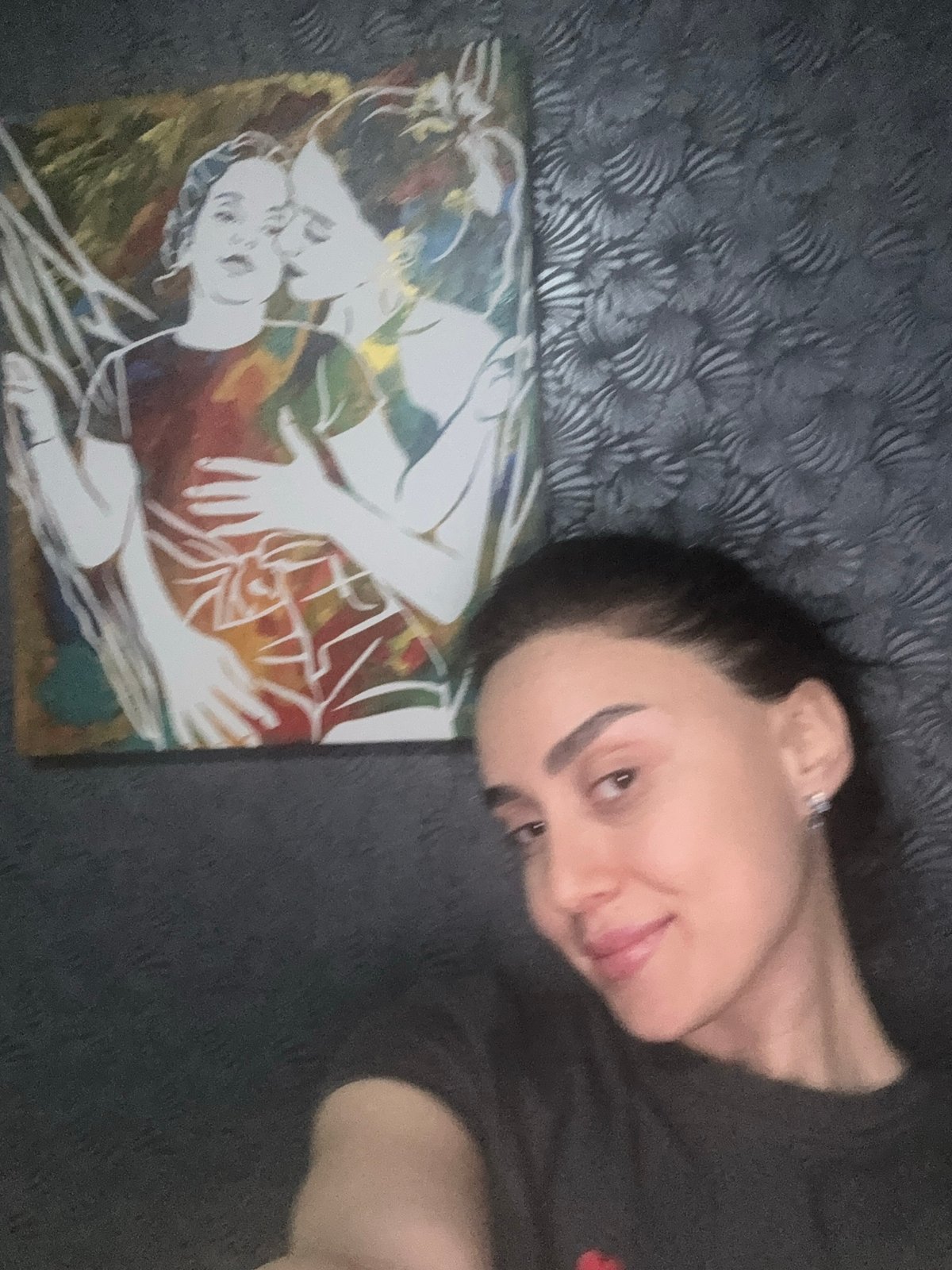 Woman relaxes at home gathering in Tbilisi