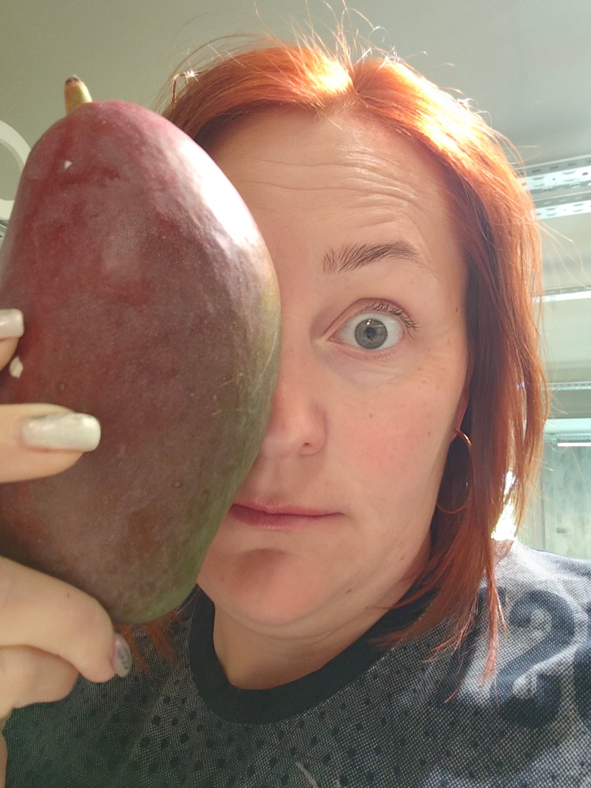 Woman poses with large fruits in early morning Russia