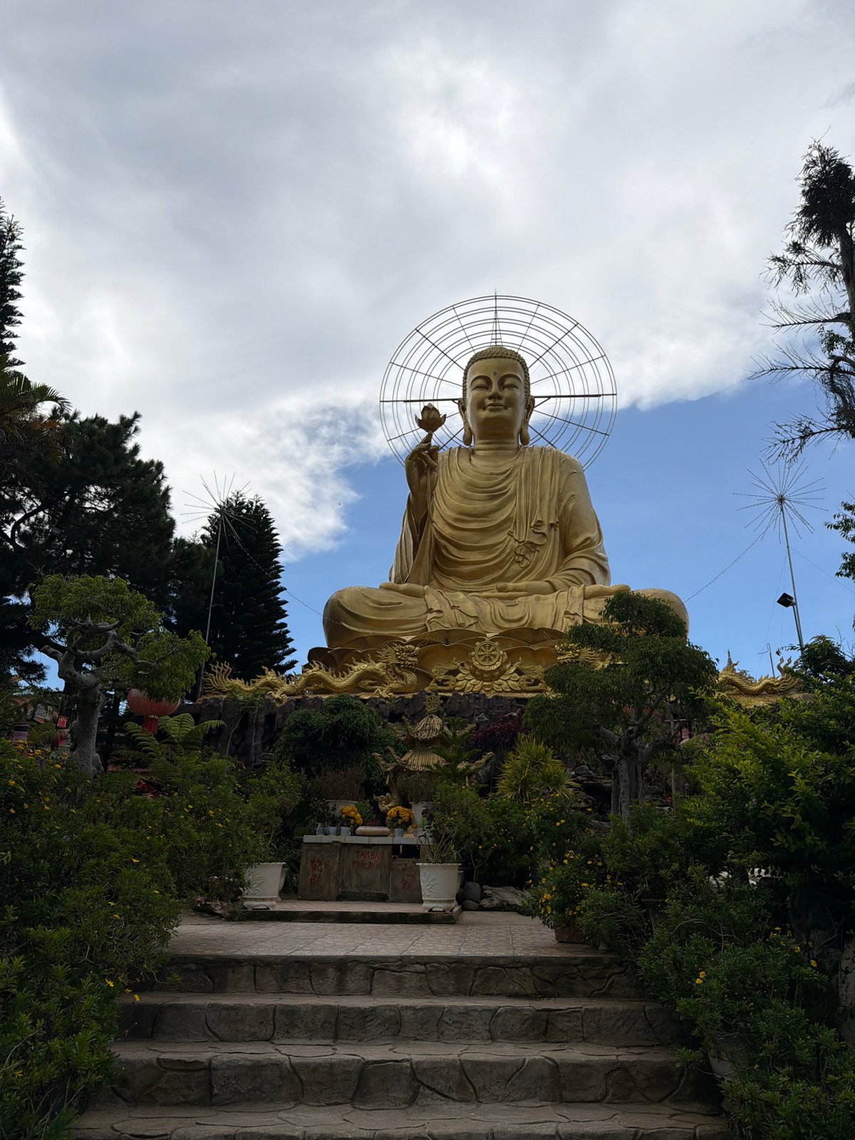 Buddhist temple complex in Đà Lạt: statues, gardens, and morning streets