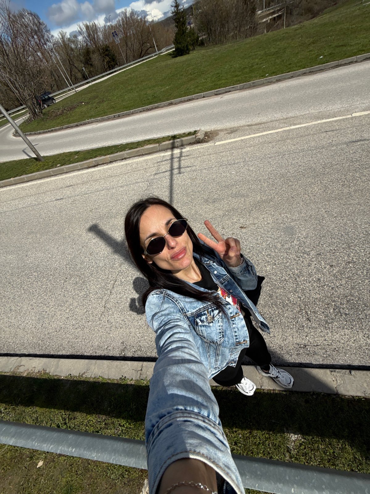 Woman takes selfie on sunny day in Pleven, Bulgaria