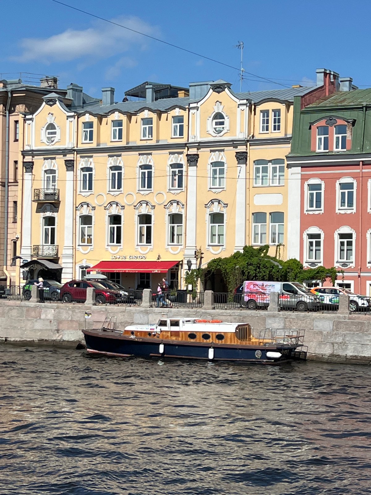Man with garbage bag walks Saint Petersburg waterfront