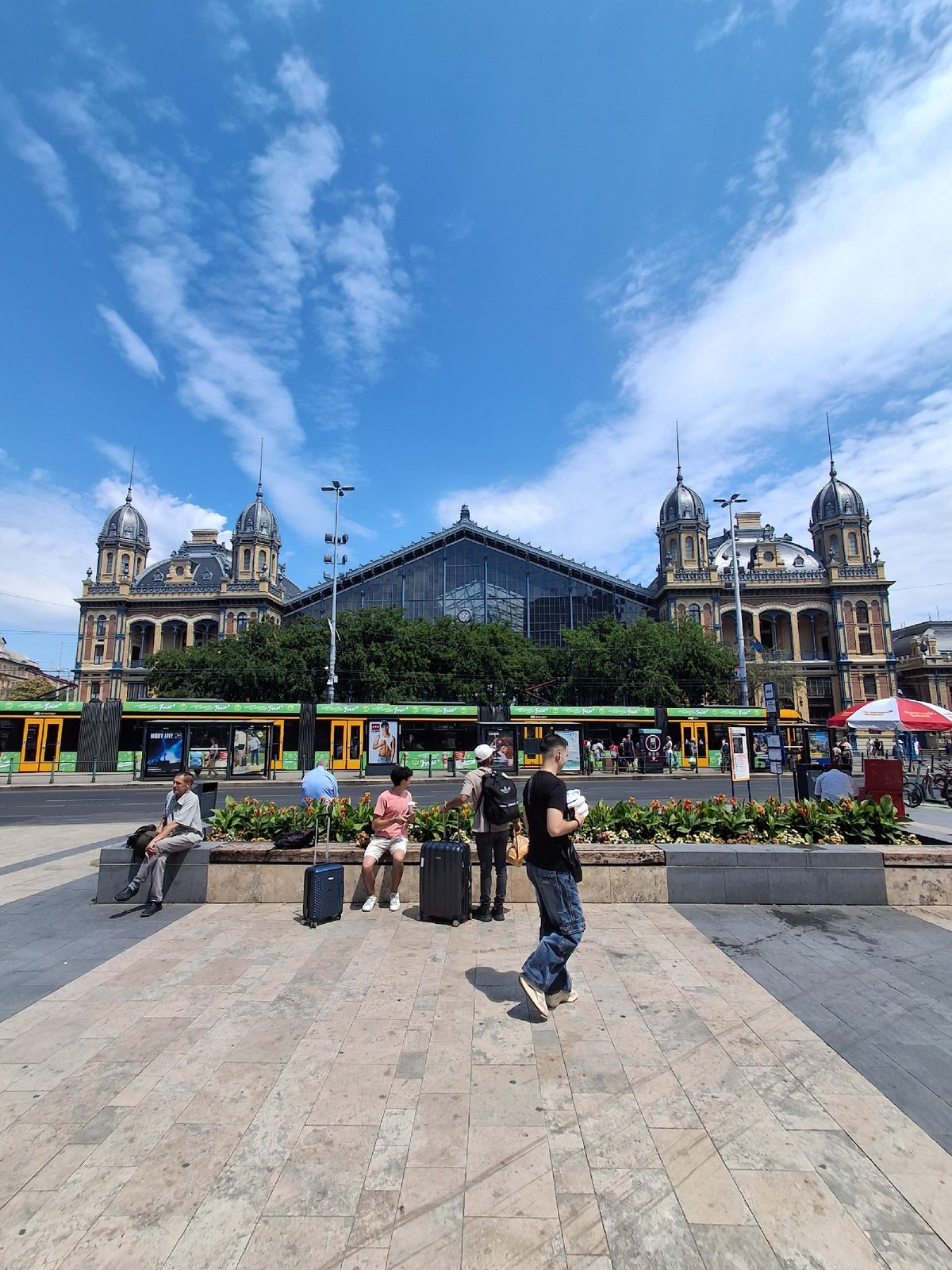 Street life around Budapest's Keleti Station on a summer morning
