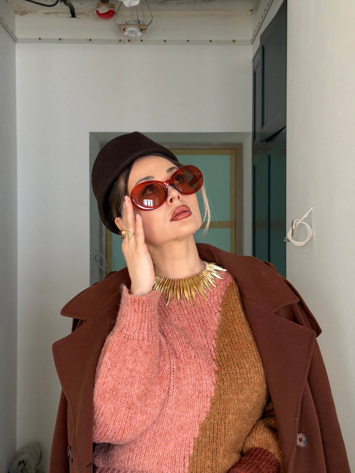 Woman in distinctive outfit photographed indoors in Krasnoyarsk