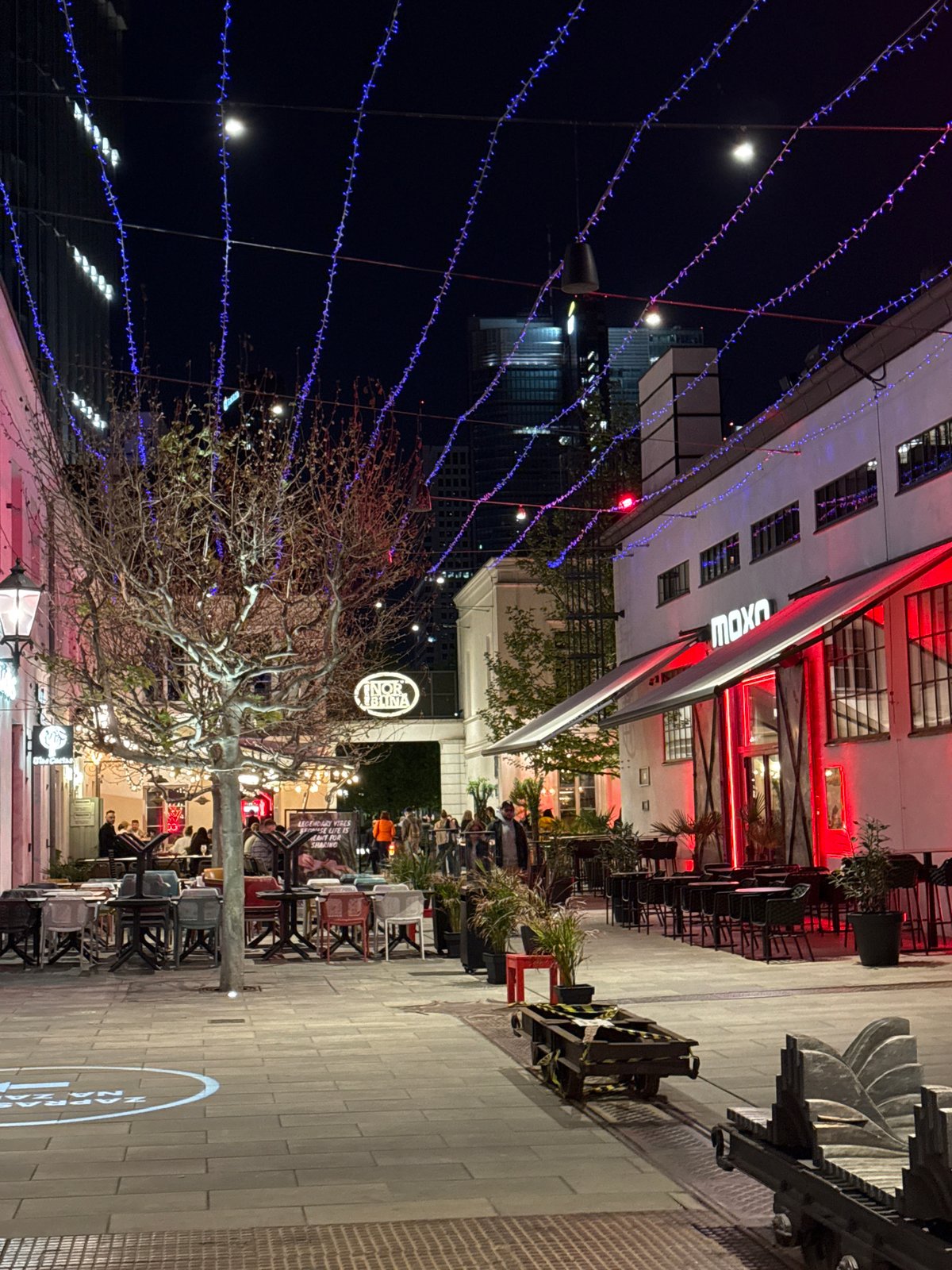 Warsaw pedestrian area bustles with evening dining activity