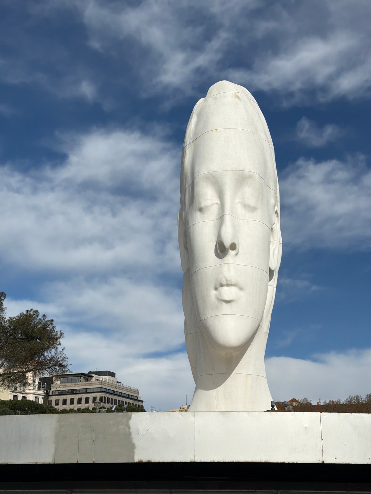 Monumental white head sculpture observed in Madrid