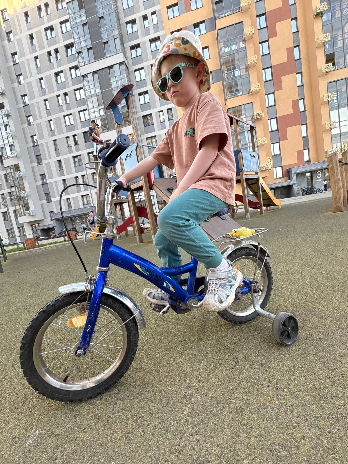 Outdoor recreation observed in Izhevsk: child cycling, forest trail