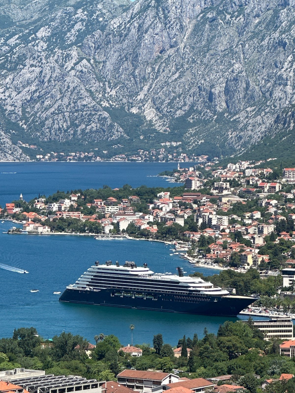 Tourists document cruise ship visit to Montenegro's Bay of Kotor