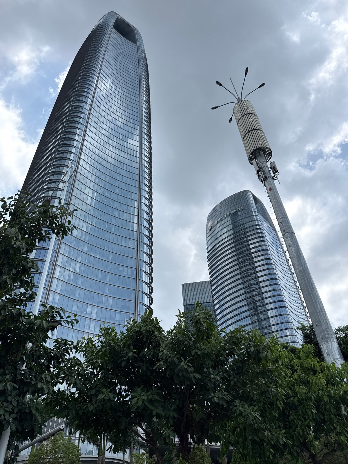 Haizhu District's modern business corridor on a cloudy morning