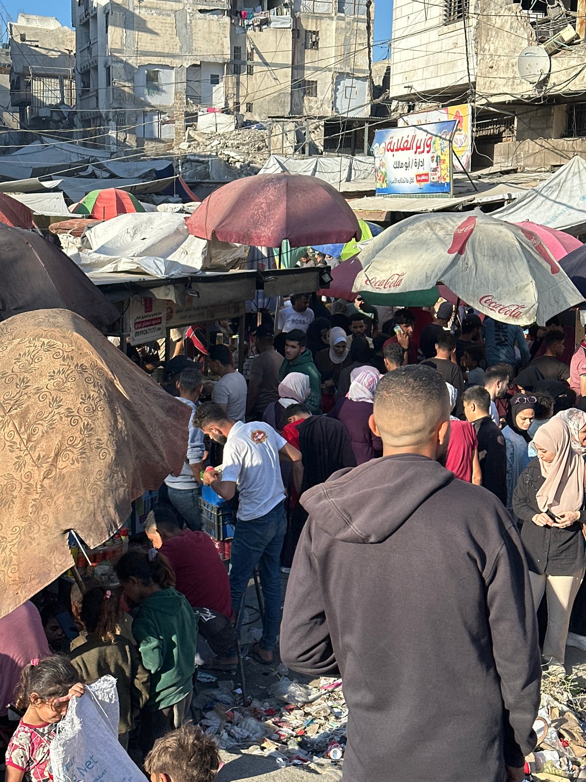 Busy marketplace operates in Gaza City amid urban setting