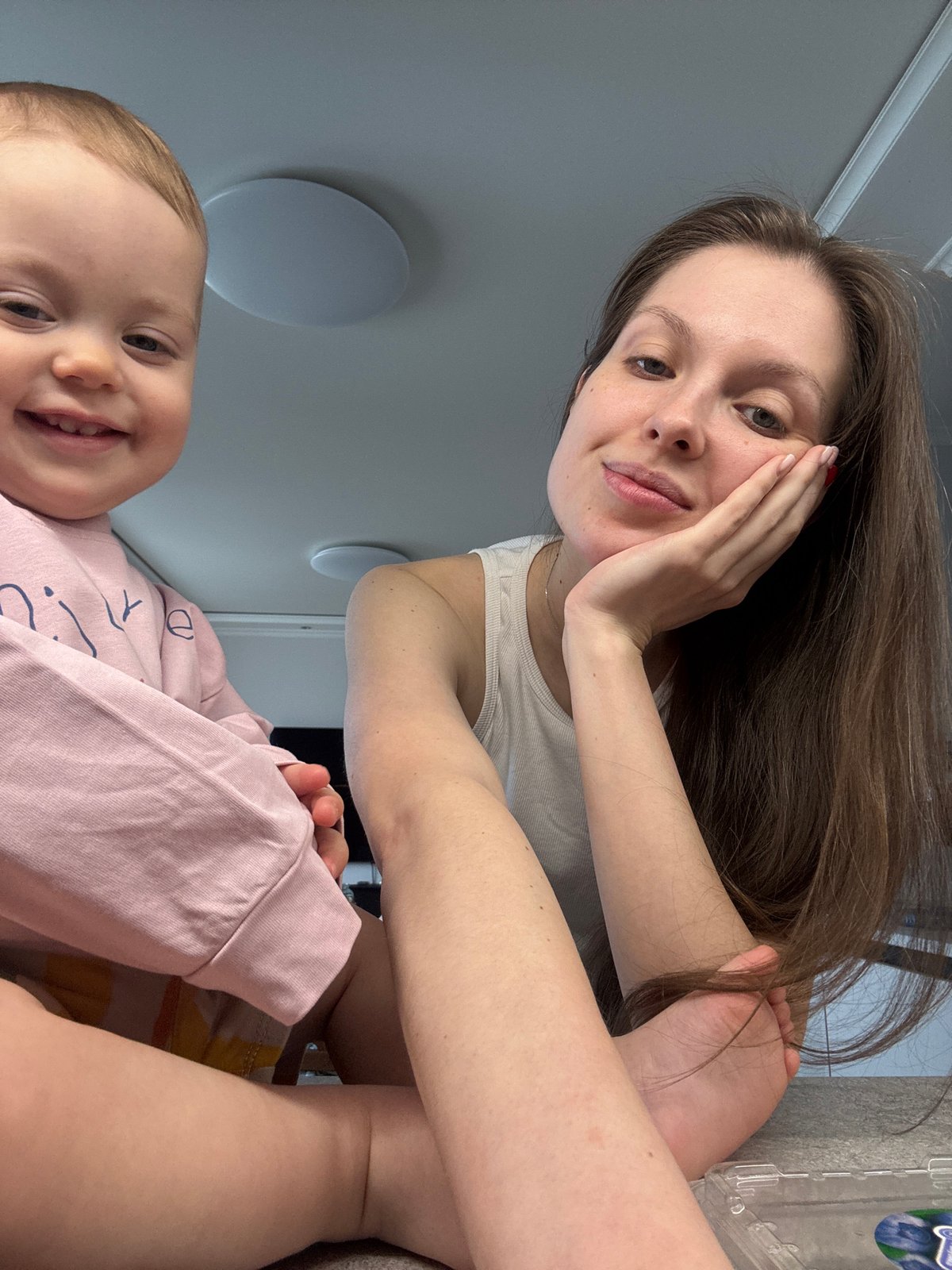 Mother and toddler share playful moments in Moscow home