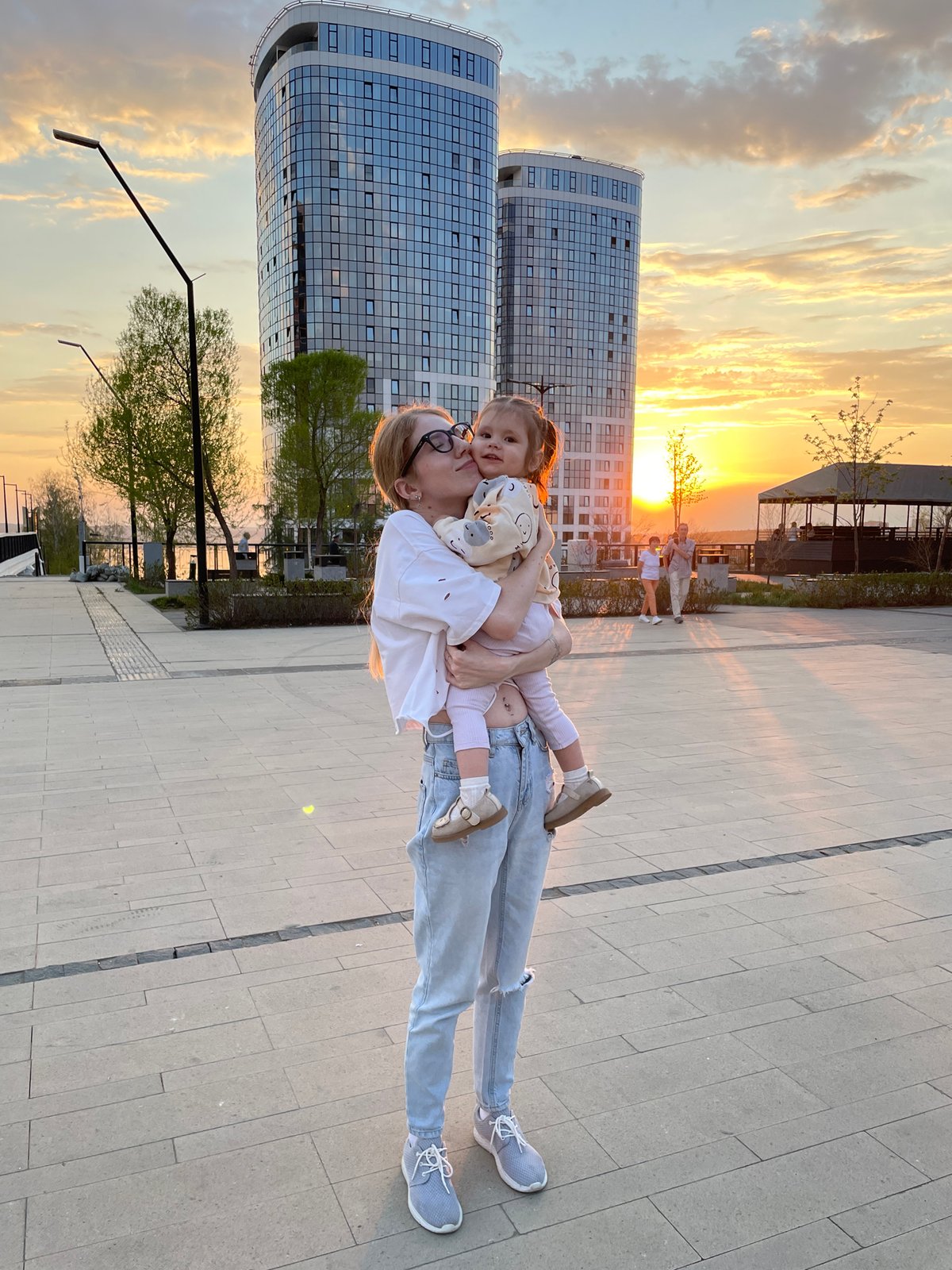 Mother and child enjoy afternoon activities in Izhevsk plaza