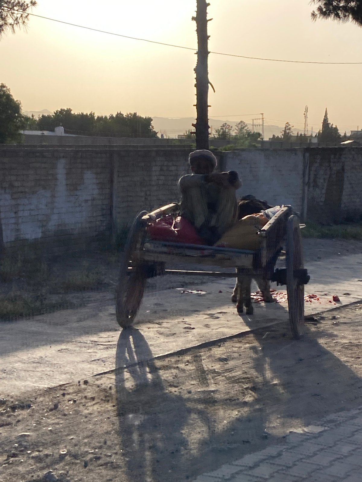 Street life captured in Quetta: cart rider, motorcycle duo