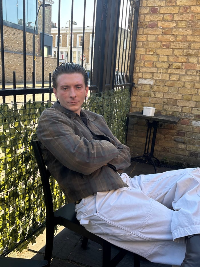 Friends gather at London pub garden on spring afternoon