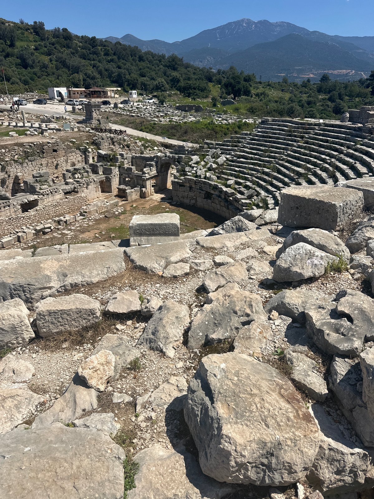 Tourist documents ancient Antiphellos ruins in Kaş, Turkey