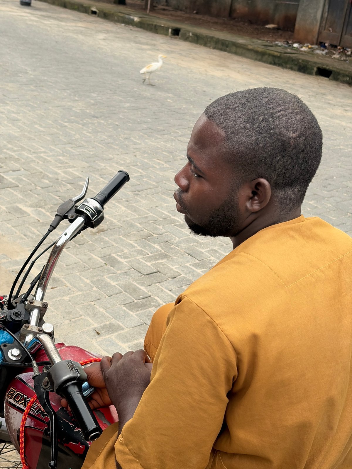 Everyday street life and overcast skies in Igboefon, Nigeria