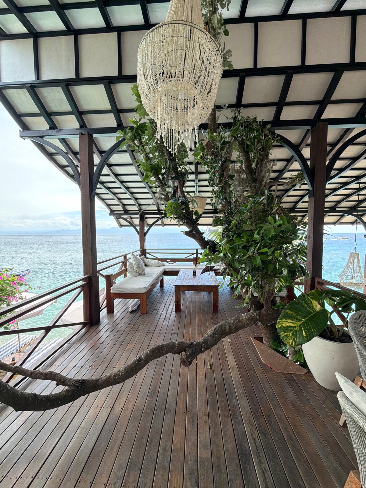 Outdoor pergola space with distinctive tree captured in Nusa Penida