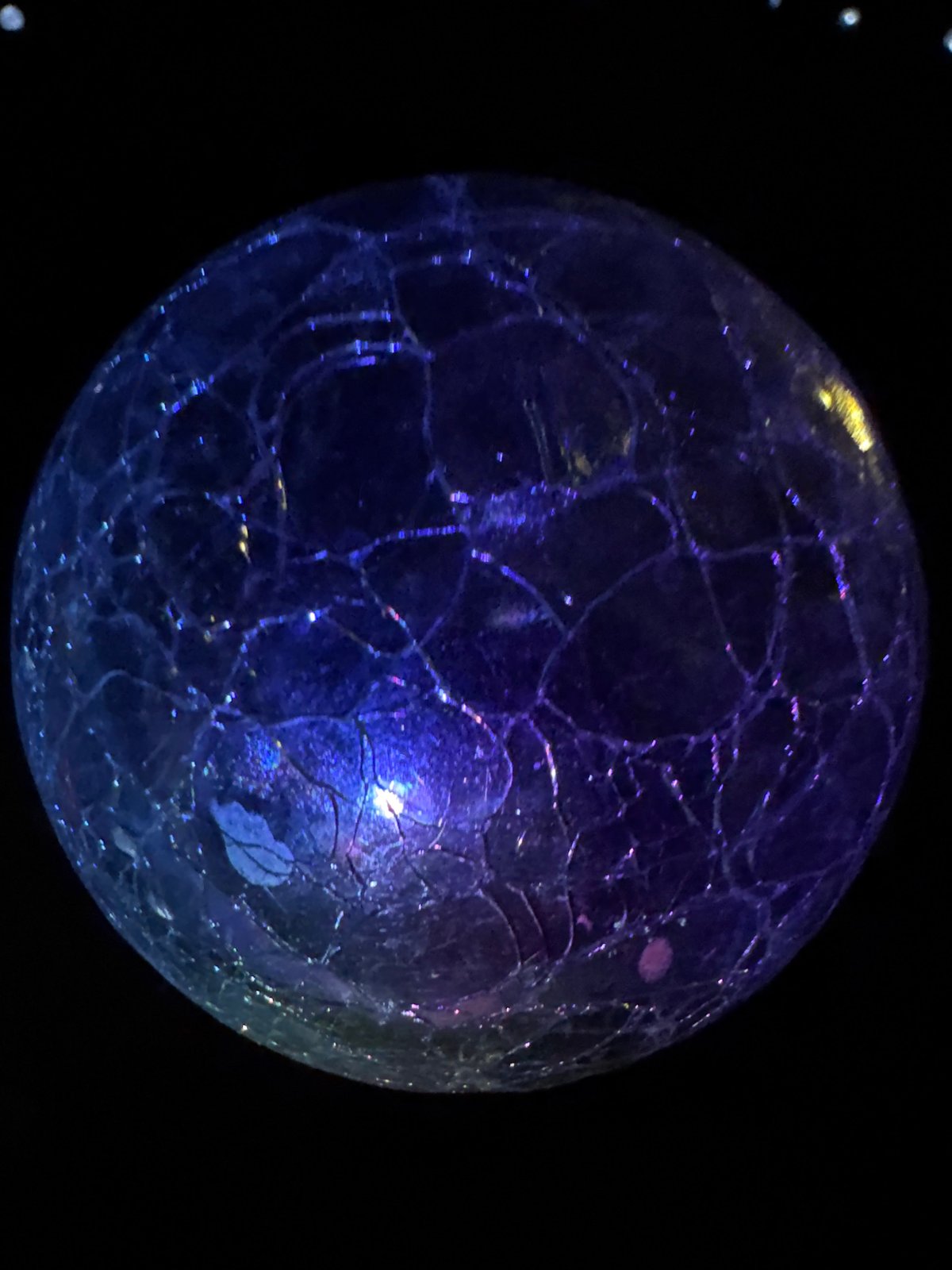Macro shots of glowing cracked glass spheres in rural Bulgaria