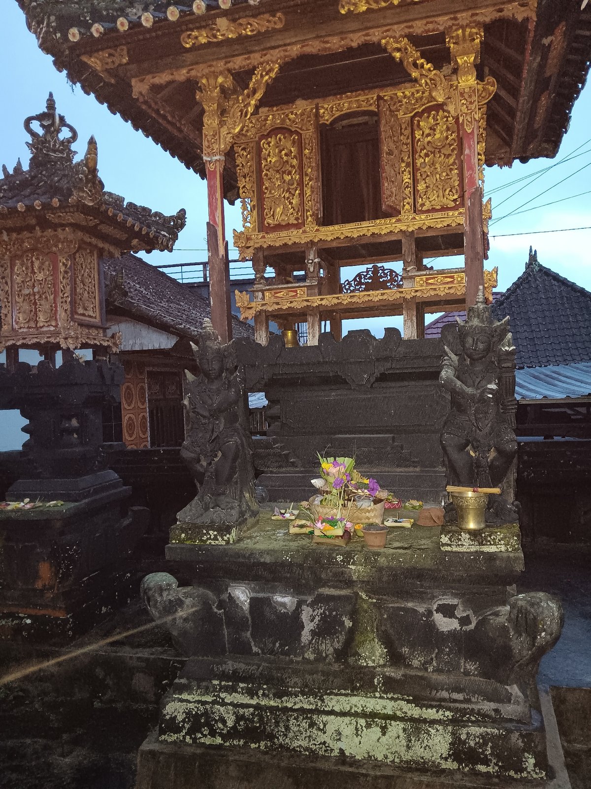 Morning observations capture Balinese architecture and baseball cap in Penebel
